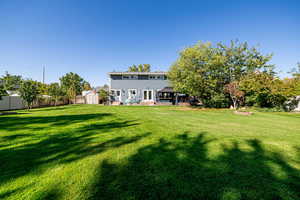 View of yard with a storage shed, firepit, and a patio