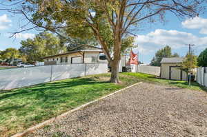 West side yard with large rv space and garden shed