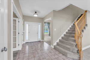 Entryway featuring carpet floors