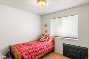 Bedroom with light wood-type flooring