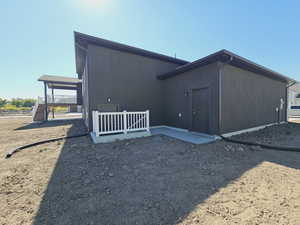 View of property exterior featuring a deck