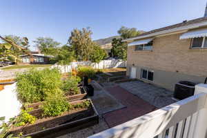 View of patio featuring central AC and a mountain view