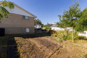 View of yard featuring central air condition unit