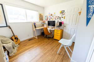 Office space featuring light hardwood / wood-style flooring