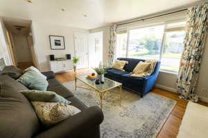 Living room with light hardwood / wood-style flooring