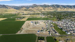 Drone / aerial view with a water and mountain view