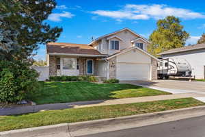 Front of home with a welcoming front porch and RV parking