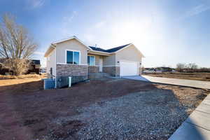 Ranch-style house featuring a garage