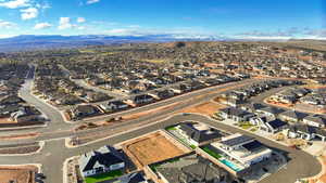 Birds eye view of property with a mountain view