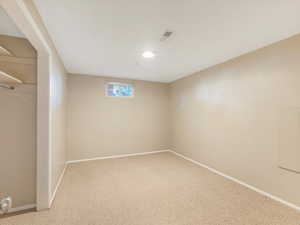 Basement featuring carpet flooring