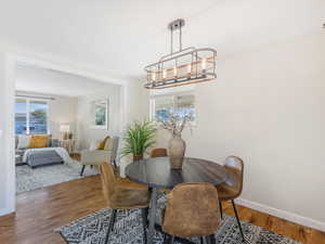 Dining area featuring a chandelier and hardwood / wood-style flooring