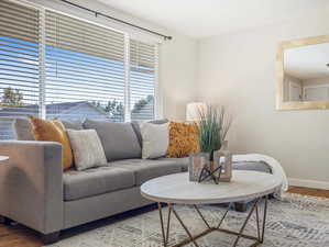 Living room with hardwood / wood-style flooring