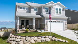 View of front of house featuring a 2 car garage and amazing views.