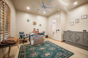 Bedroom/Office with light wood-type flooring and ceiling fan