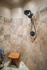 Room details with tiled shower