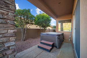 View of patio / terrace with a hot tub