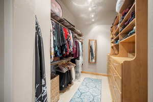 Spacious closet featuring hardwood / wood-style flooring