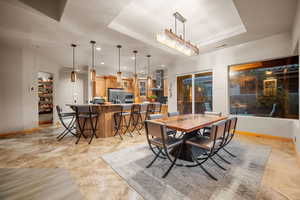 Dining area with a tray ceiling