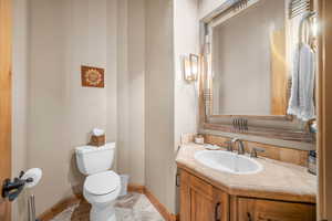 Bathroom featuring vanity and toilet