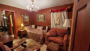 Bedroom featuring a chandelier