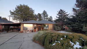 View of front of property with a carport