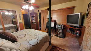 Carpeted bedroom with door out to patio