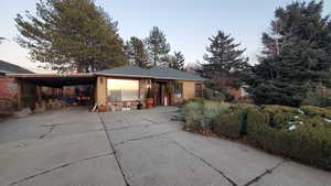 View of front of property with a carport