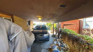 View of vehicle parking with a carport