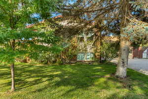 Front of home with lots of trees for privacy