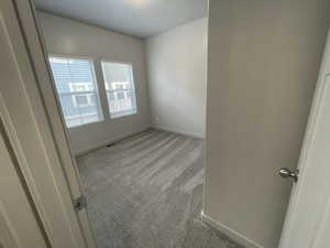 Entrance to the second-floor bedroom with brand-new, upgraded carpeting.