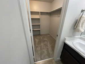 Walk-in closet with built-in shelving.