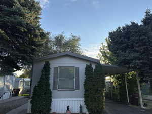 View of home's exterior featuring a carport