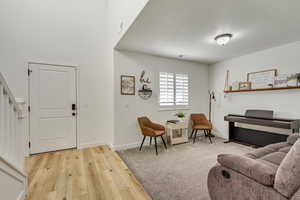 Living room with light hardwood / wood-style flooring