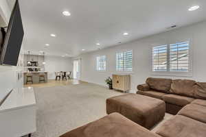 Living room with light colored carpet