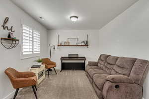 Living room featuring carpet flooring