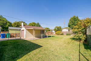 fully fenced yard with covered patio