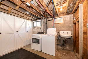 Laundry area has sink and plenty of built in storage cabinets. washer & dryer stay