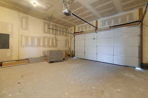 Garage with a garage door opener and electric panel