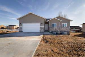 View of front facade featuring a garage