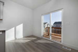 Unfurnished room featuring hardwood / wood-style floors
