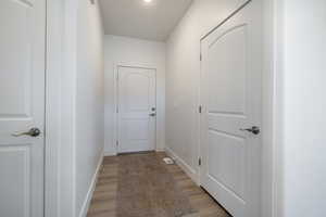 Hall featuring light wood-type flooring