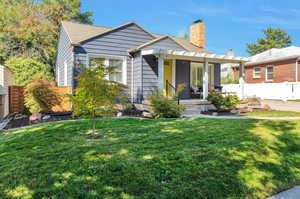 Bungalow-style home featuring a front lawn