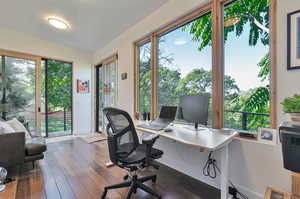 Office area with dark wood-type flooring