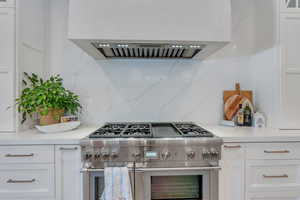 Professional appliance package with 3 ovens in kitchen