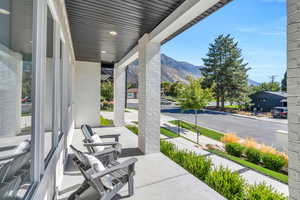 View of patio / terrace featuring a mountain view and covered porch