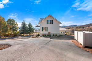 View of side of property featuring a mountain view