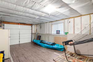Garage with white refrigerator