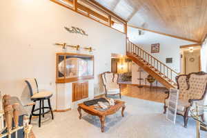 Tiled living room with wood ceiling and vaulted ceiling