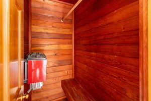 View of sauna / steam room featuring wood walls