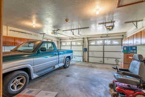 Garage featuring a garage door opener